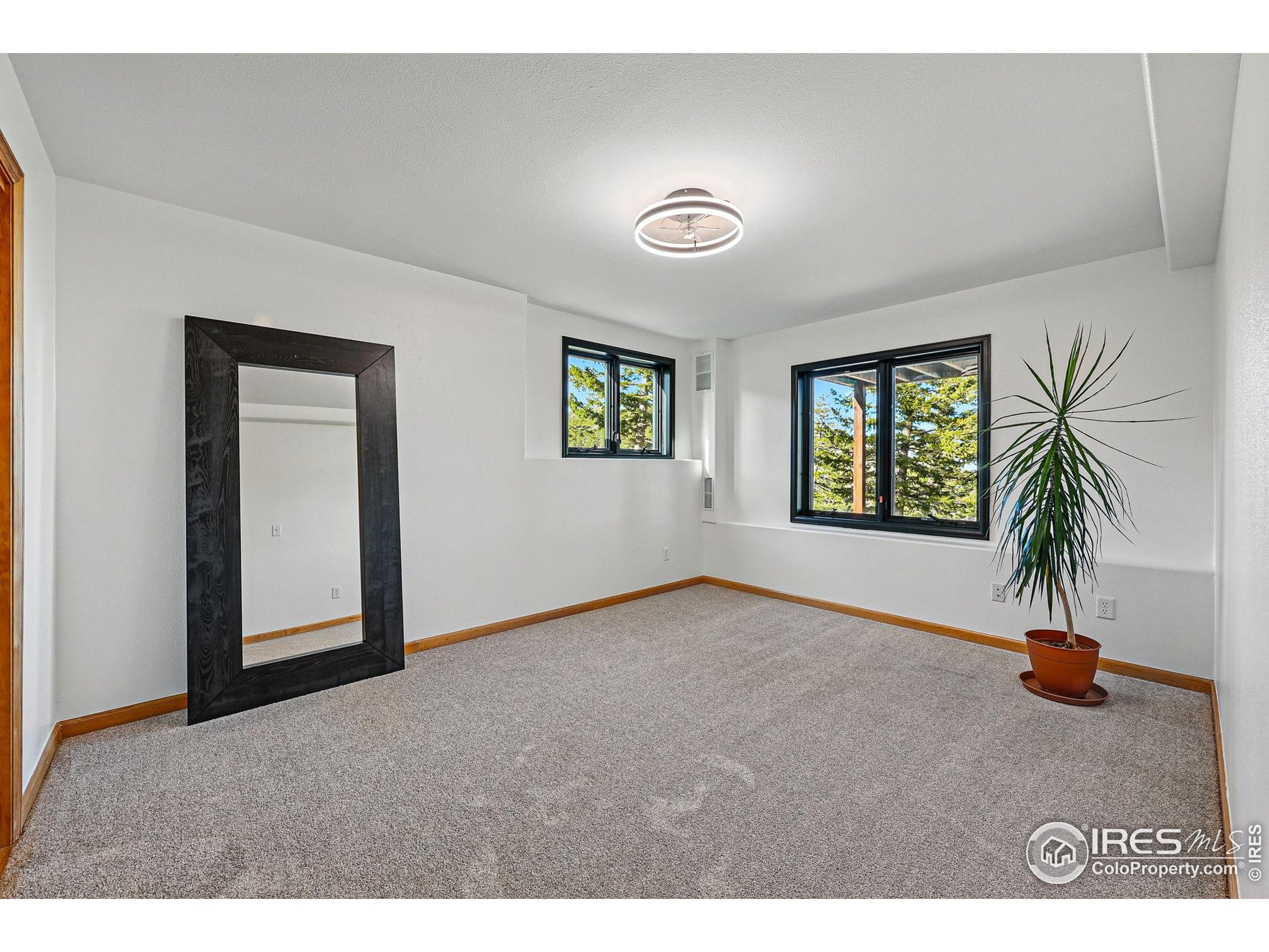 98 Rim Road Boulder, CO 80302 - Photo 27 of 43 a view of an empty room and window