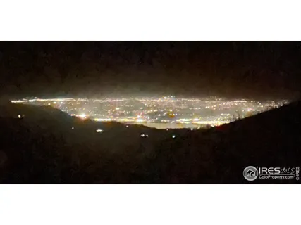 a view of a room with furniture and wooden floor