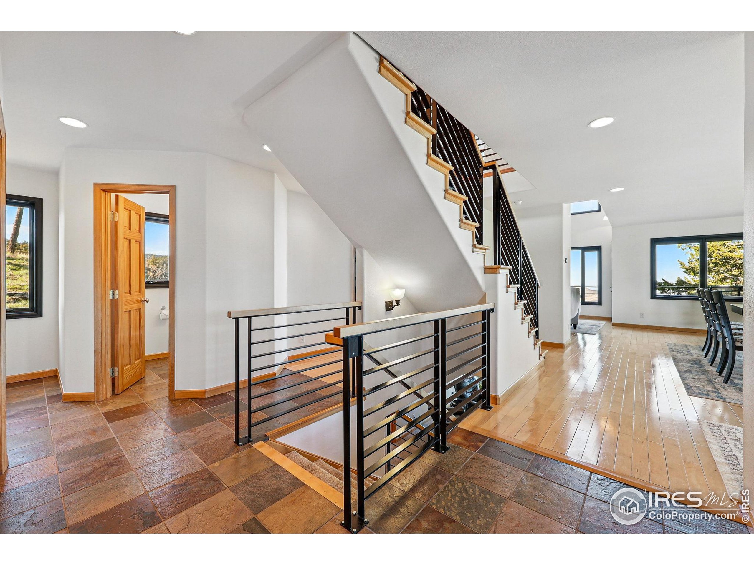98 Rim Road Boulder, CO 80302 - Photo 6 of 43 a living room with furniture and a wooden floor