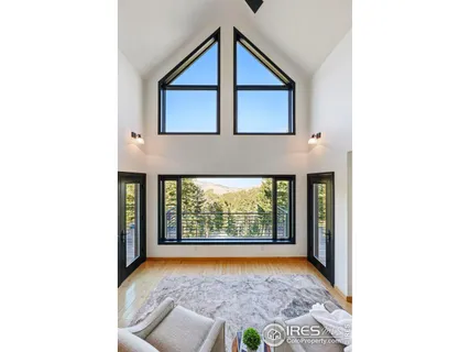 a front view of a house with large windows