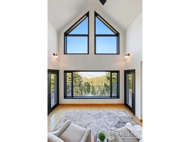 a front view of a house with large windows