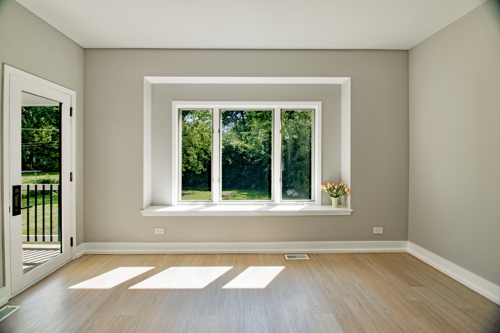 33485 North Mill Road Grayslake, IL 60030 - Photo 11 of 28 a view of an empty room with wooden floor and a window