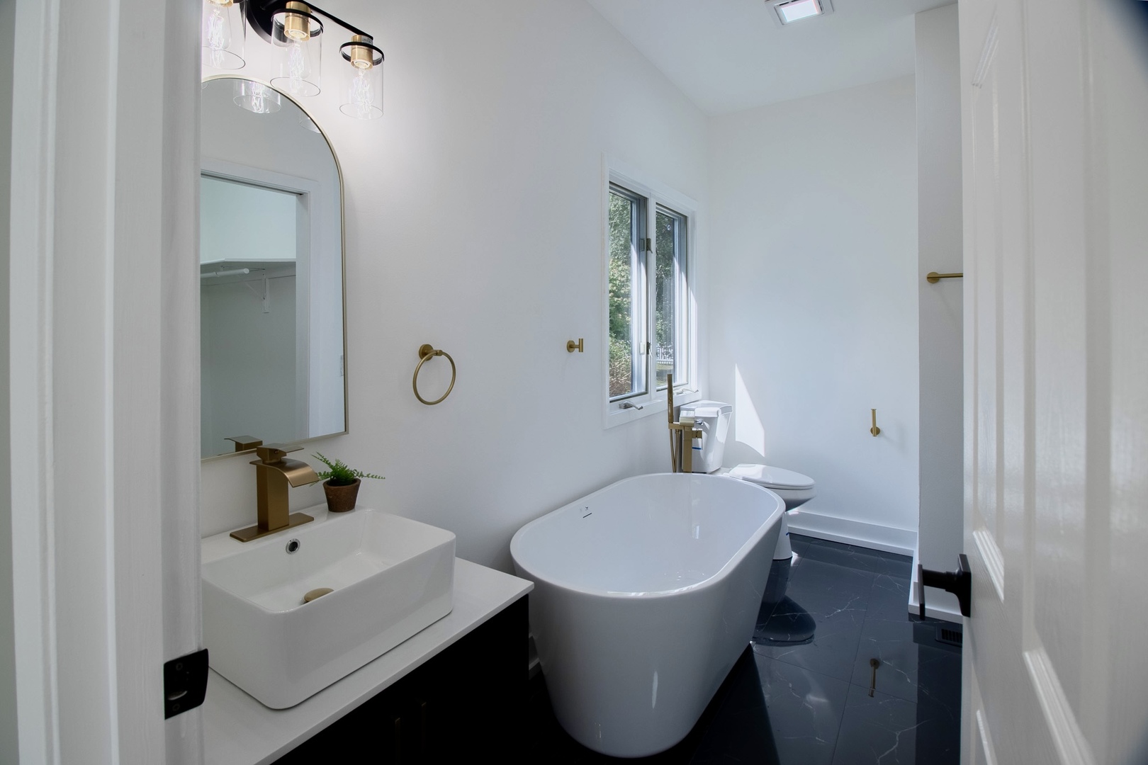 33485 North Mill Road Grayslake, IL 60030 - Photo 12 of 28 a bathroom with a toilet sink and mirror