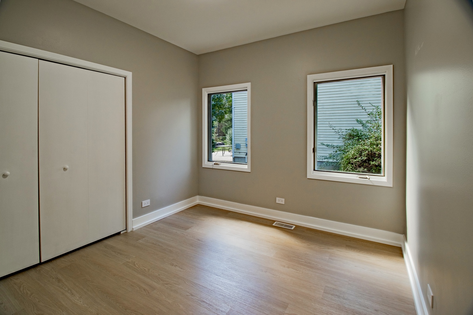 33485 North Mill Road Grayslake, IL 60030 - Photo 14 of 28 a view of an empty room with wooden floor and a window