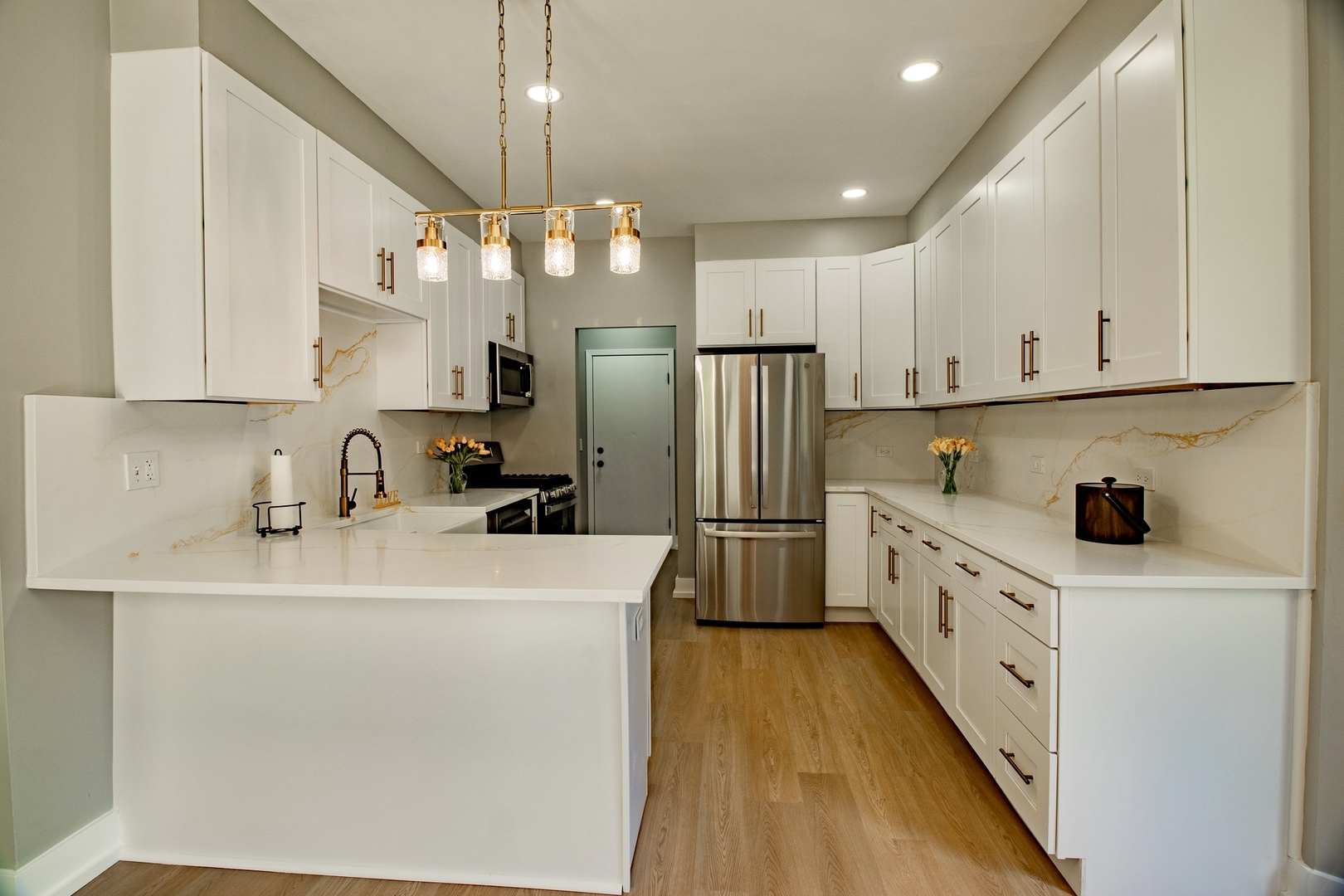 33485 North Mill Road Grayslake, IL 60030 - Photo 8 of 28 a kitchen with stainless steel appliances a refrigerator sink and white cabinets