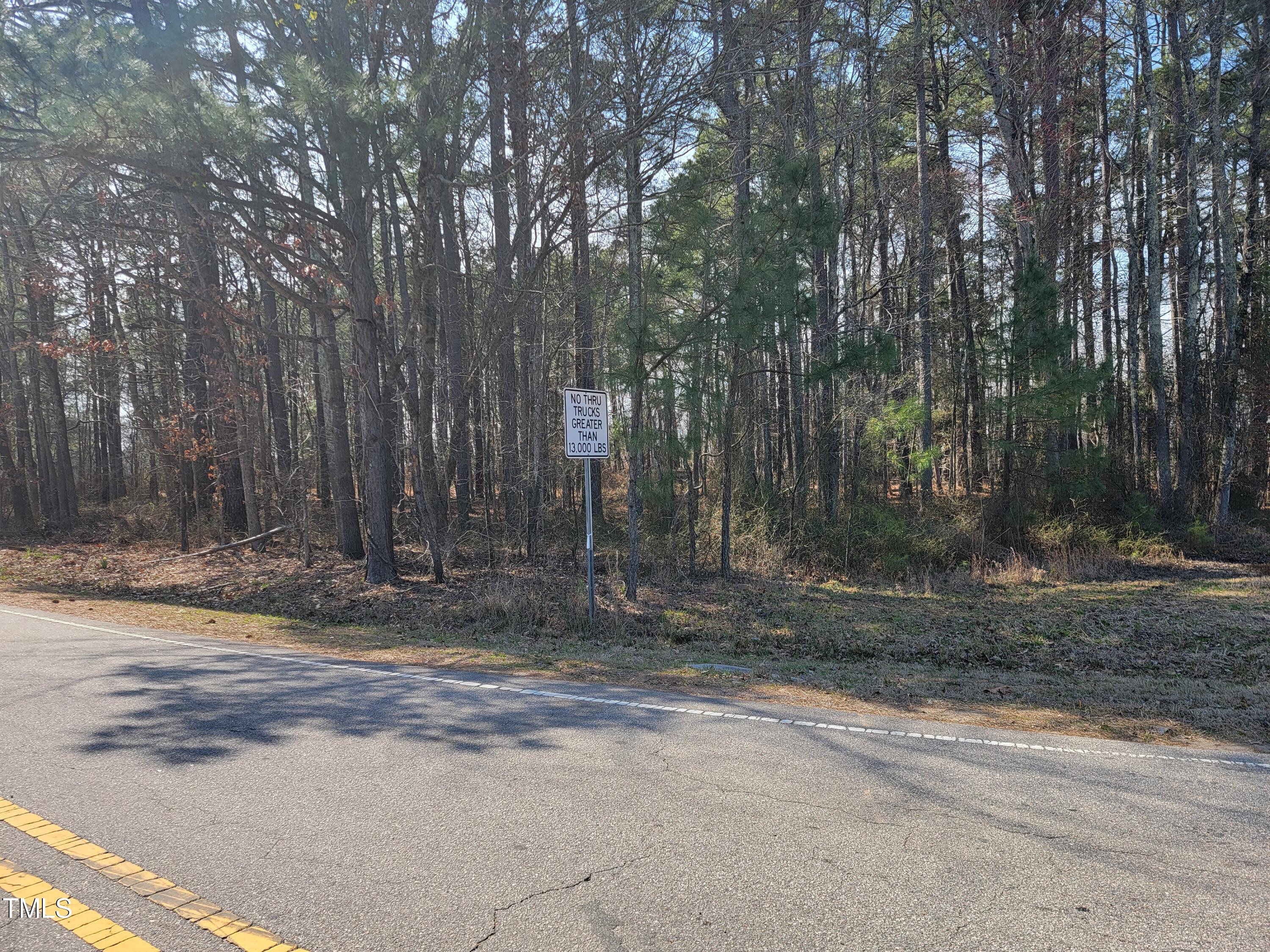 2506 Coley Road Durham, NC 27703 - Photo 18 of 20 a view of a yard with large trees