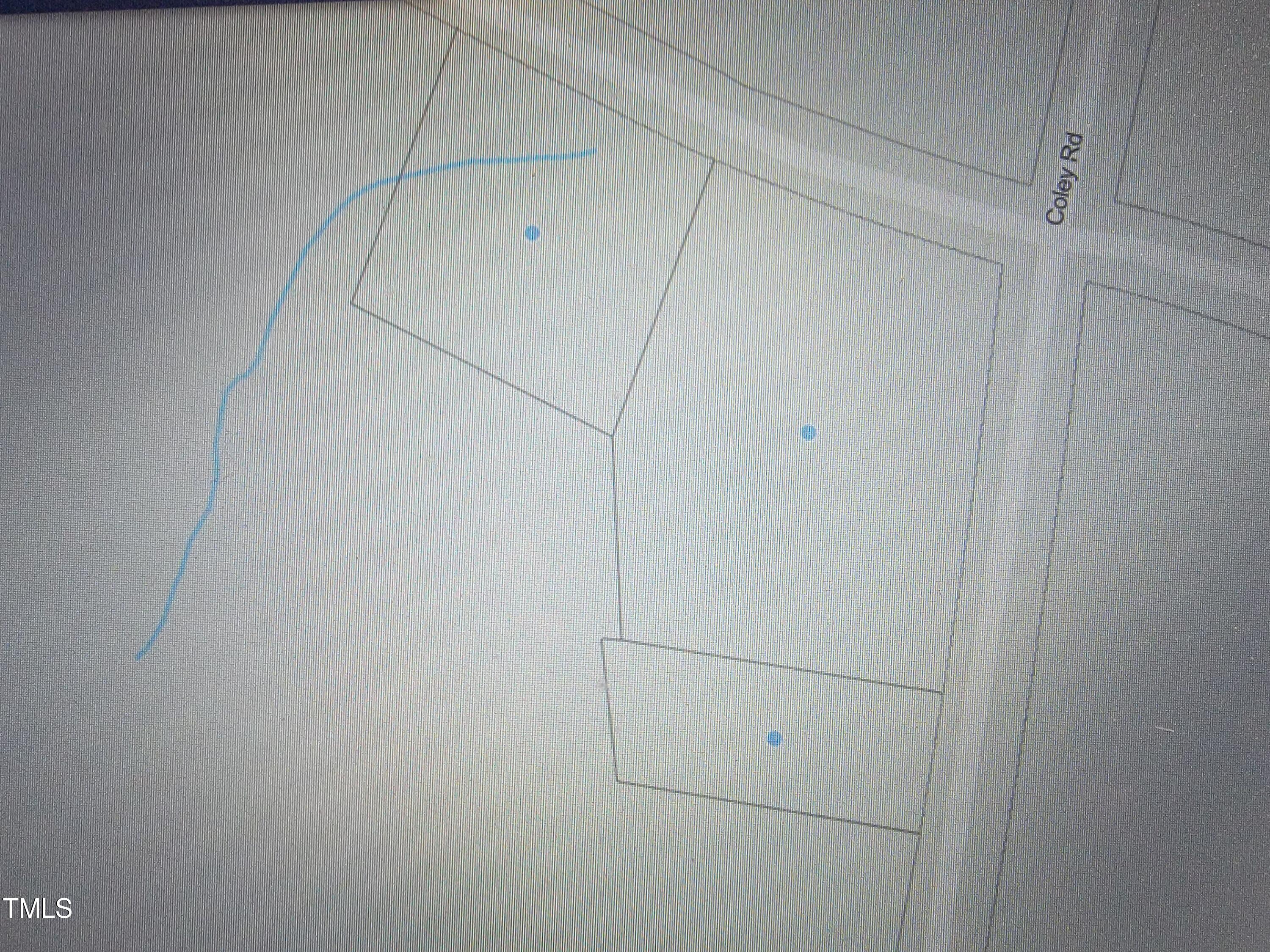 2506 Coley Road Durham, NC 27703 - Photo 6 of 20 a view of storage and utility room with racks on the wall