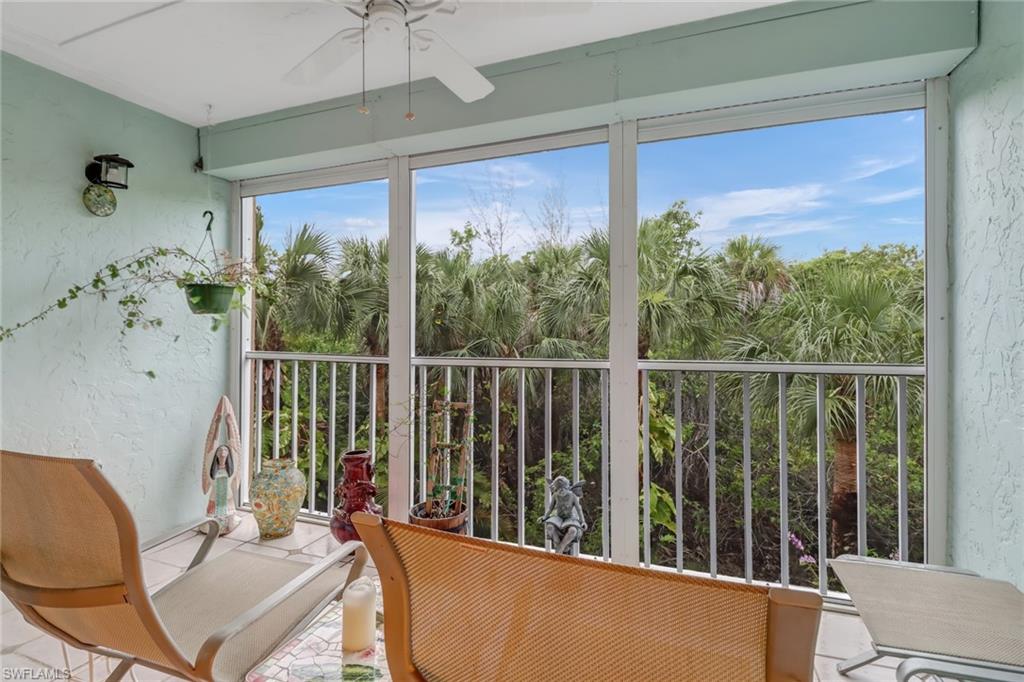 3041 Sandpiper Bay Circle, Unit H201 Naples, FL 34112 - Photo 24 of 25 Sunroom / solarium with a textured wall