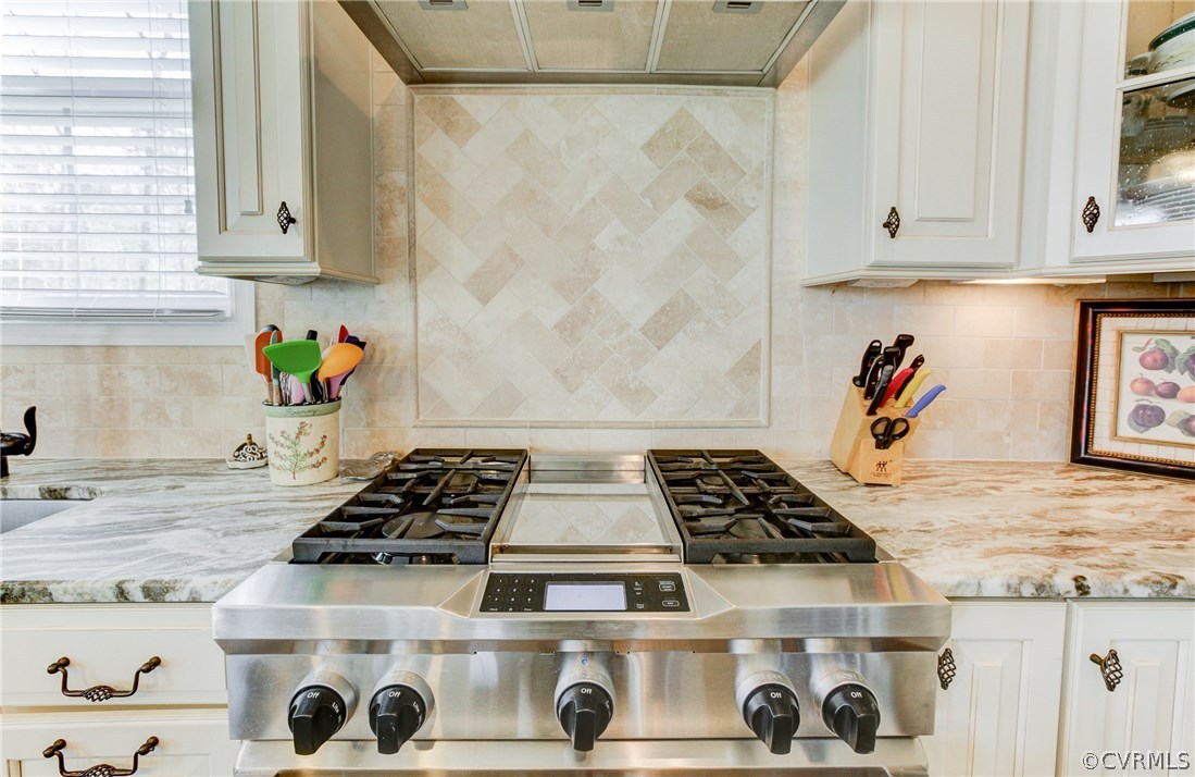 1106 Miners Trail Road Midlothian, VA 23114 - Photo 17 of 38 a kitchen with a stove and wooden cabinets