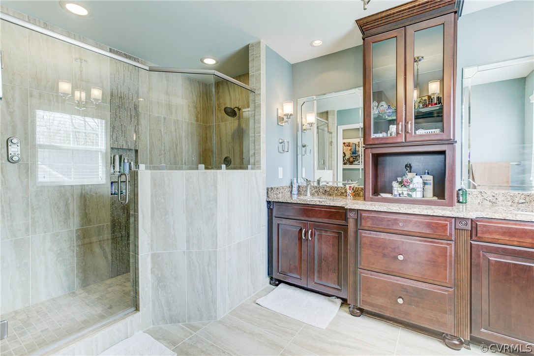 1106 Miners Trail Road Midlothian, VA 23114 - Photo 24 of 38 a bathroom with a granite countertop sink mirror and shower