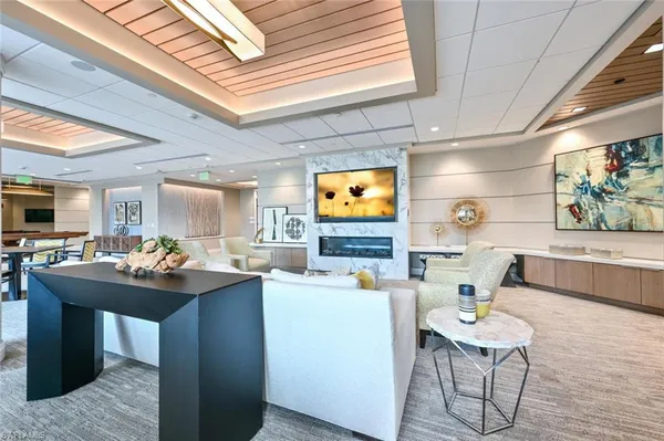 a kitchen with a table chairs sink and cabinets