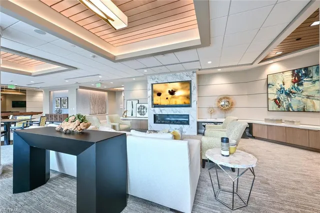 a kitchen with a table chairs sink and cabinets