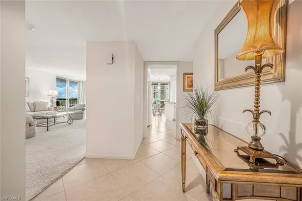 a hallway with a sink and cabinets