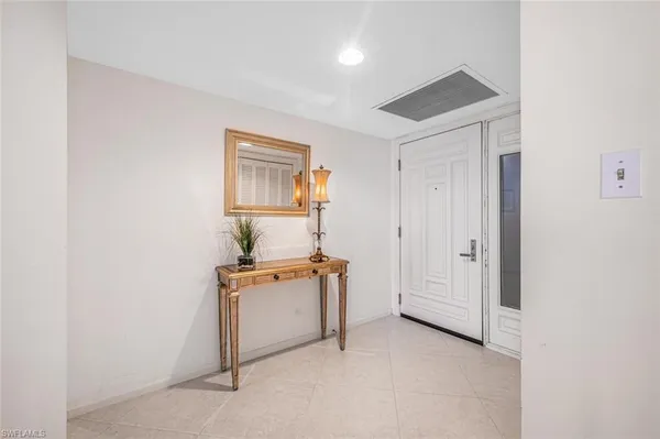 a view of kitchen and cabinets