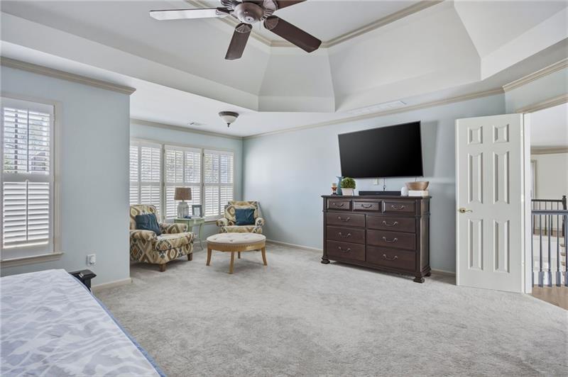 4862 Manatee Court Northwest Powder Springs, GA 30127 - Photo 26 of 46 a living room with furniture and a flat screen tv