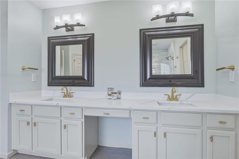 4862 Manatee Court Northwest Powder Springs, GA 30127 - Photo 28 of 46 a bathroom with a sink vanity and mirror
