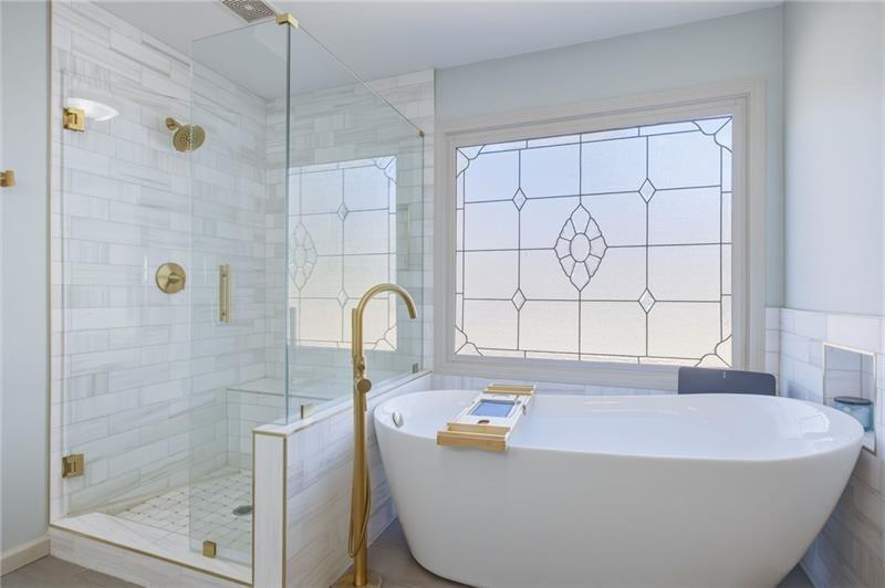 4862 Manatee Court Northwest Powder Springs, GA 30127 - Photo 30 of 46 a bath tub sitting next to a shower