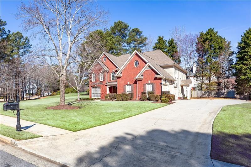 4862 Manatee Court Northwest Powder Springs, GA 30127 - Photo 3 of 46 a front view of a house with a yard