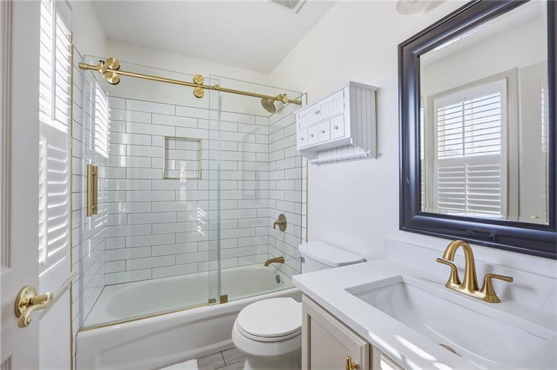 4862 Manatee Court Northwest Powder Springs, GA 30127 - Photo 32 of 46 a bathroom with a sink a toilet and shower