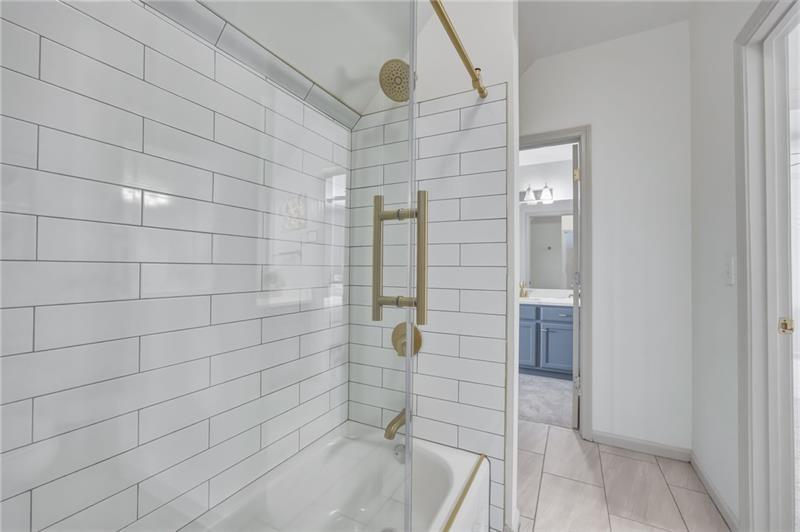 4862 Manatee Court Northwest Powder Springs, GA 30127 - Photo 35 of 46 a bathroom with a shower