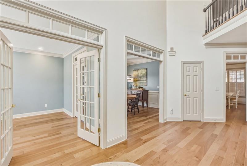 4862 Manatee Court Northwest Powder Springs, GA 30127 - Photo 5 of 46 a view of a hallway and wooden floor and dining room