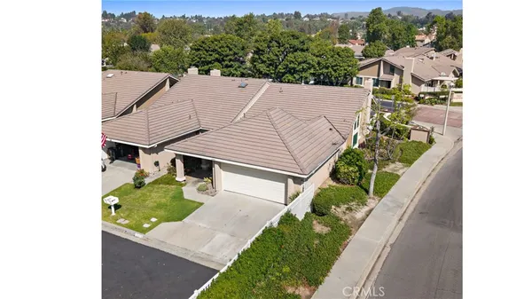 a aerial view of a house with a yard