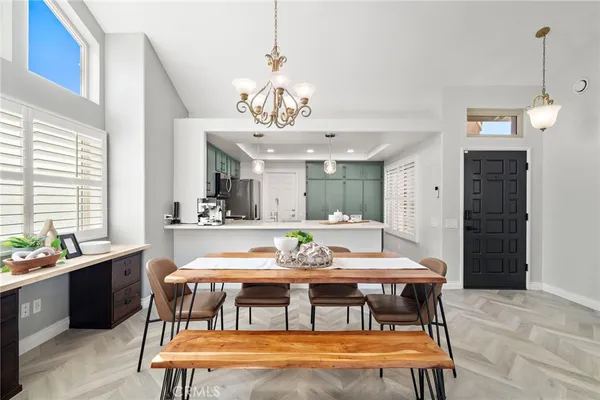 a view of a dining room with furniture window and outside view