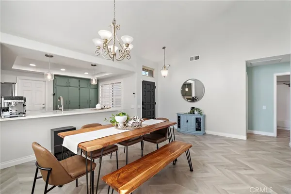 a living room with dining table and chairs