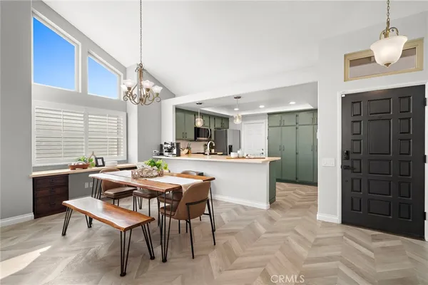 a view of a dining room with furniture and window