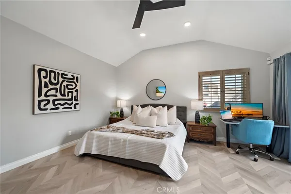 a bedroom with bed and a window