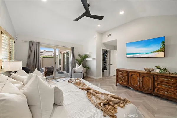 a living room with furniture ceiling fan and a rug