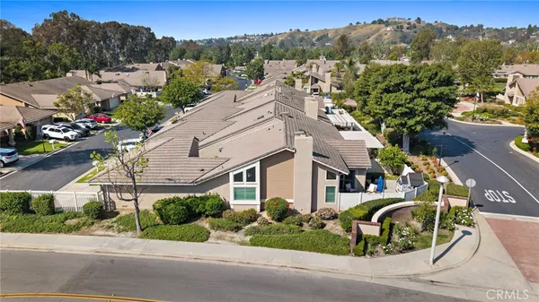 an aerial view of a house with a garden