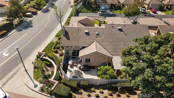 an aerial view of a house with a garden