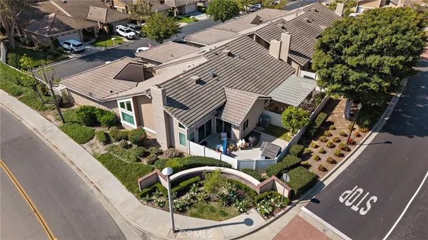 an aerial view of a house with swimming pool and porch