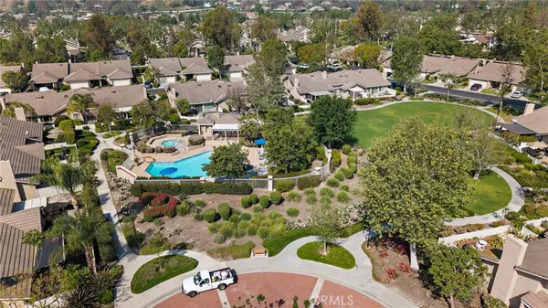 a view of a back yard of the house and front view of a house