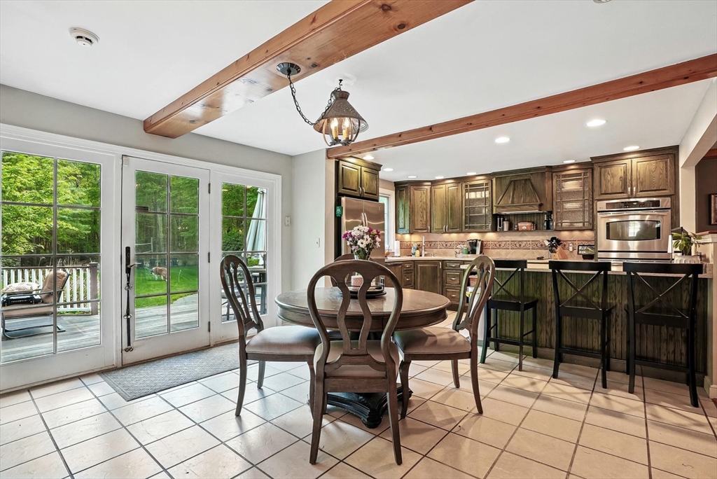 56 Grafton Road Upton, MA 01568 - Photo 12 of 34 a view of a dining room with furniture window and outside view