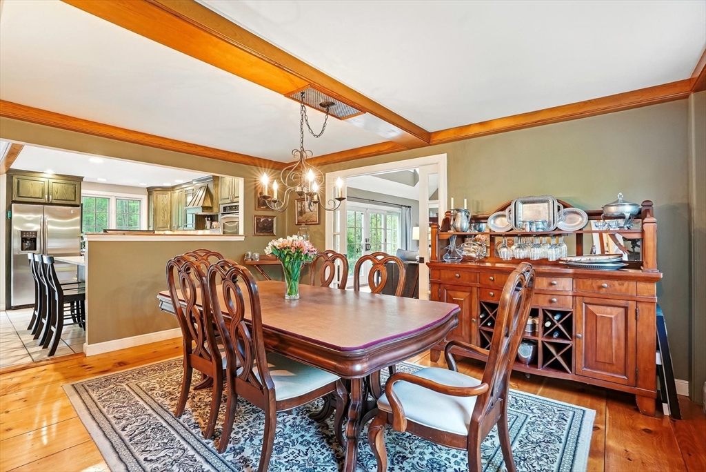 56 Grafton Road Upton, MA 01568 - Photo 14 of 34 a dining room with furniture and wooden floor