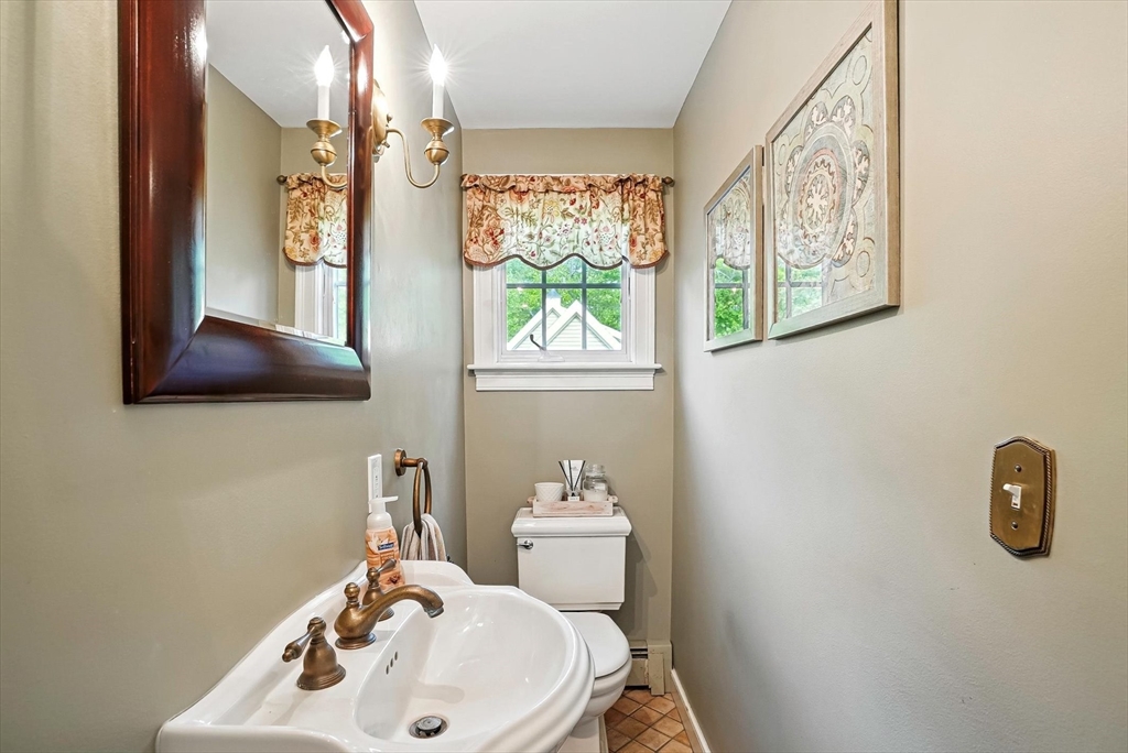 56 Grafton Road Upton, MA 01568 - Photo 19 of 34 a bathroom with a sink mirror and toilet