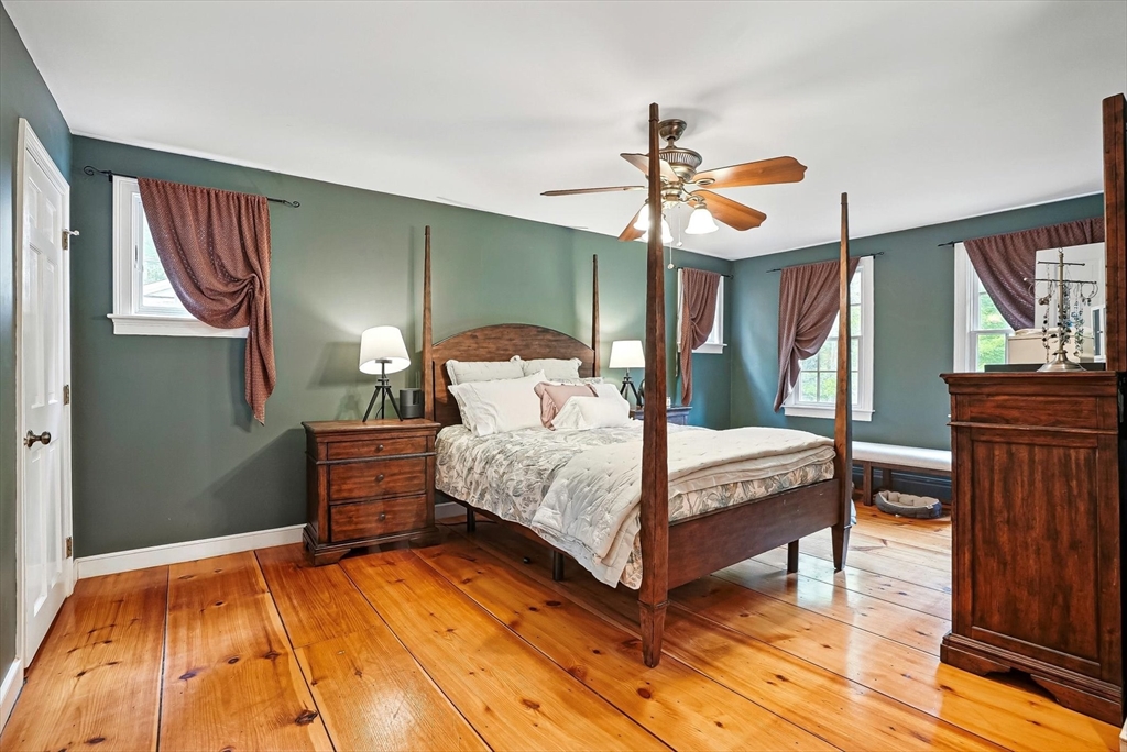 56 Grafton Road Upton, MA 01568 - Photo 20 of 34 a bedroom with a bed a dresser and window