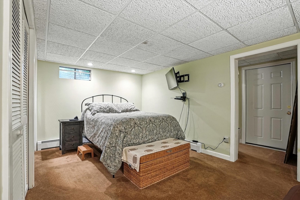 56 Grafton Road Upton, MA 01568 - Photo 26 of 34 a room with a bed and a table