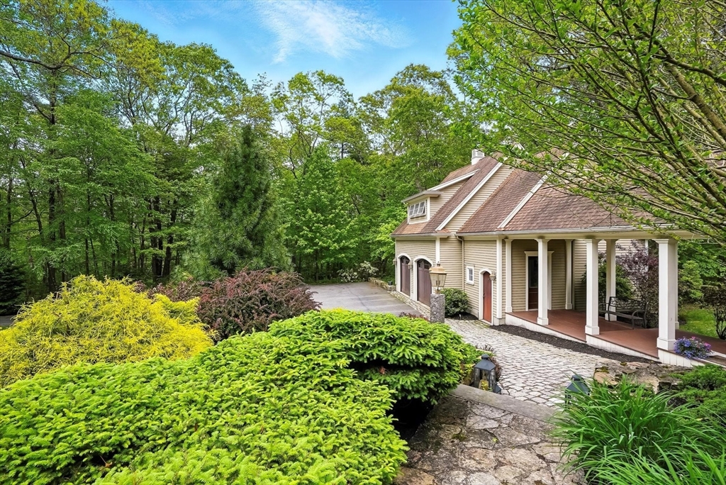 56 Grafton Road Upton, MA 01568 - Photo 5 of 34 a front view of a house with a yard