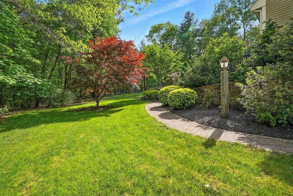 56 Grafton Road Upton, MA 01568 - Photo 6 of 34 a backyard of a house with lots of green space
