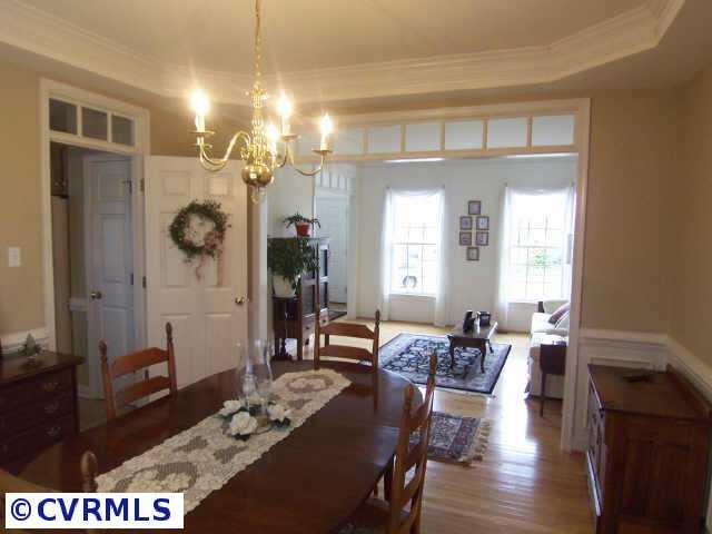 1130 Goswick Ridge Road Midlothian, VA 23114 - Photo 2 of 10 a view of a a dining room with furniture window and wooden floor