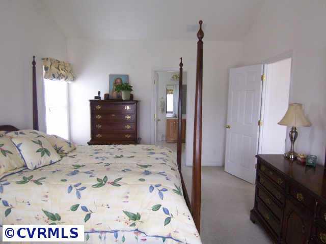 1130 Goswick Ridge Road Midlothian, VA 23114 - Photo 8 of 10 a bedroom with a bed and a dresser in it