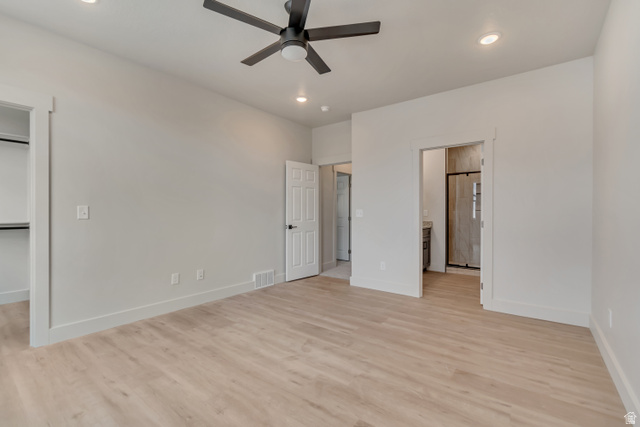 2535 West Santa Fe Drive Mapleton, UT 84664 - Photo 12 of 26 Unfurnished bedroom with recessed lighting, light wood-style floors, a walk in closet, ceiling fan, and ensuite bathroom