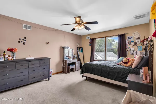 a bed room with a bed and a window