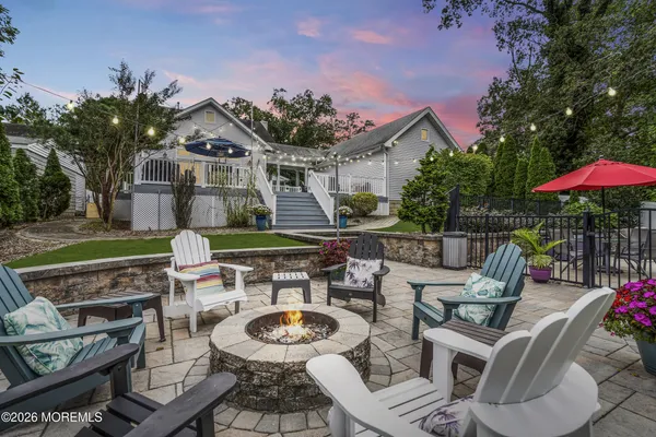 a patio with tables and chairs