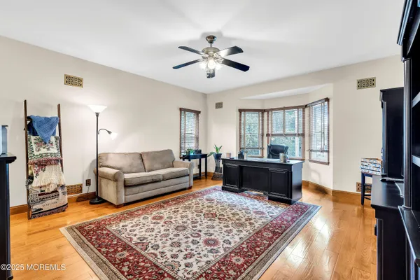 a living room with furniture and a rug