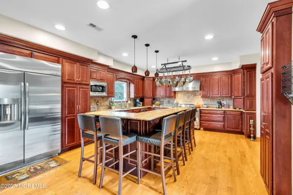 a kitchen with a table and chairs in it