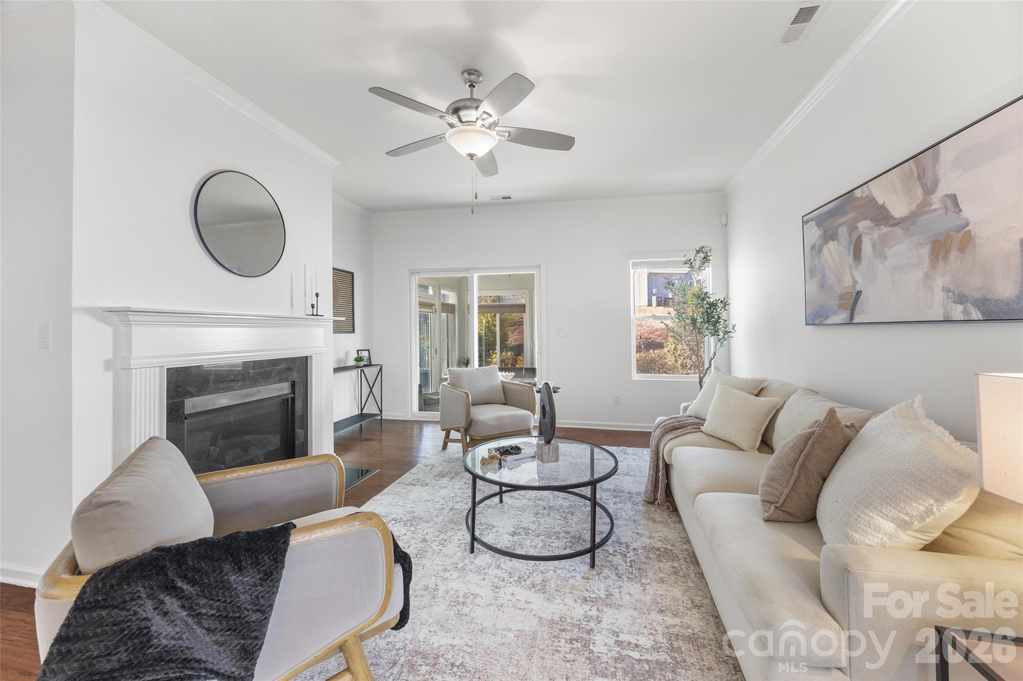 a living room with furniture and a fireplace